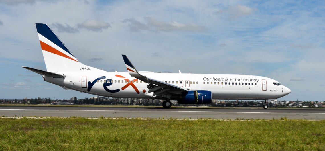 A Boeing 737 with registration VH-RQC having landing in Sydney in full Rex livery.